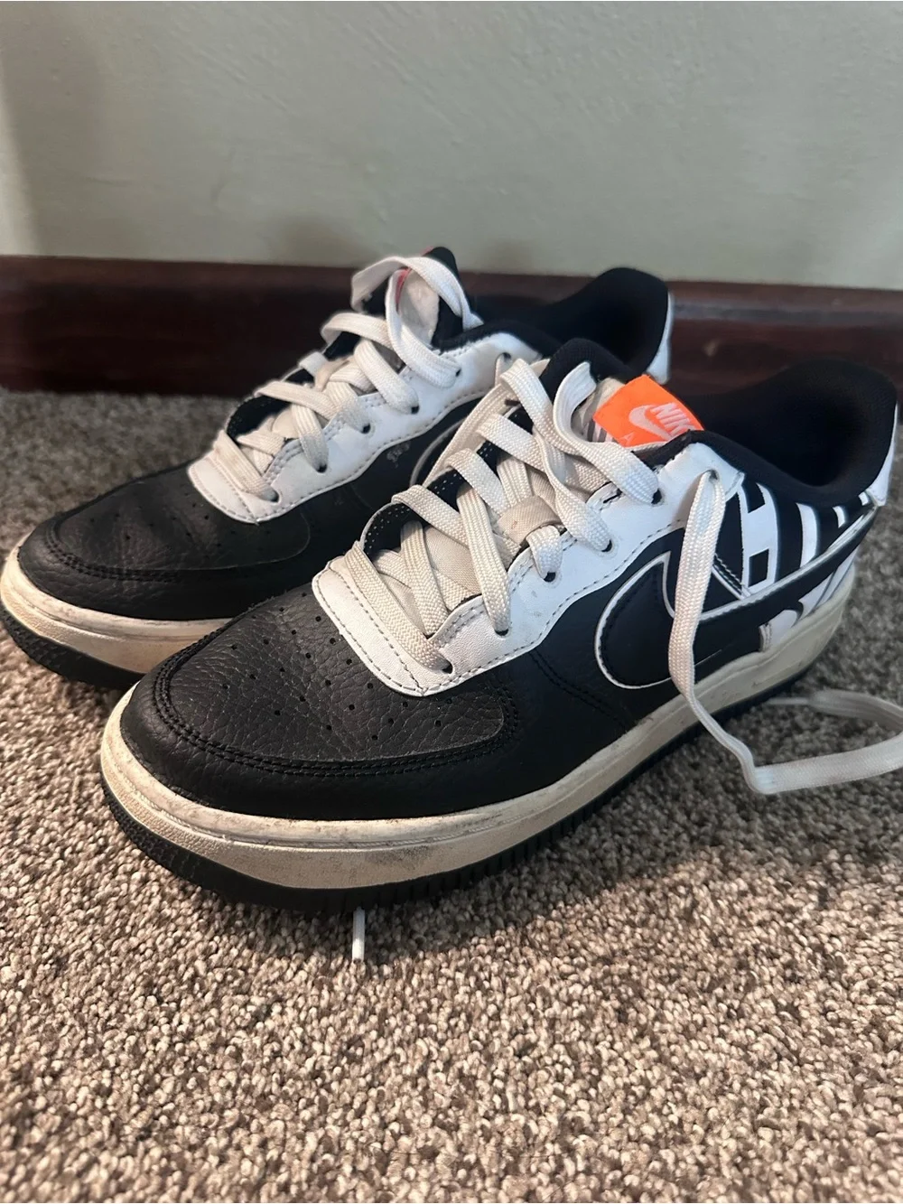 Nike Black & White Low-Top Sneakers with Orange Tongue Tag